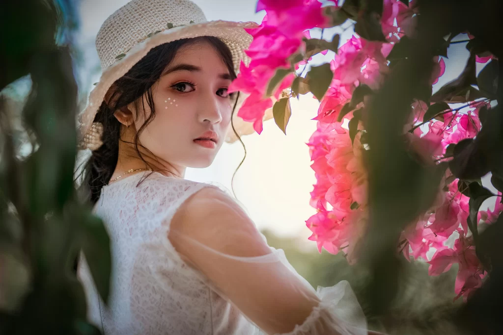 Beautiful asian girl with flowers 