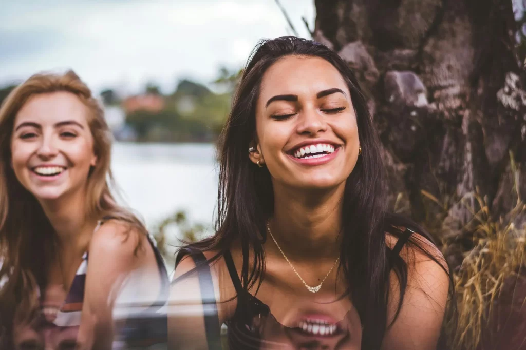 Beautiful brunette olive skinned woman laughing