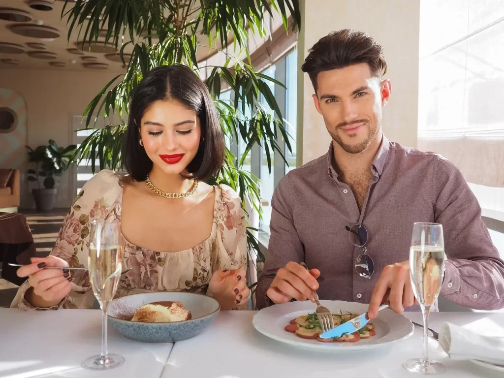 Man and woman eating dinner together