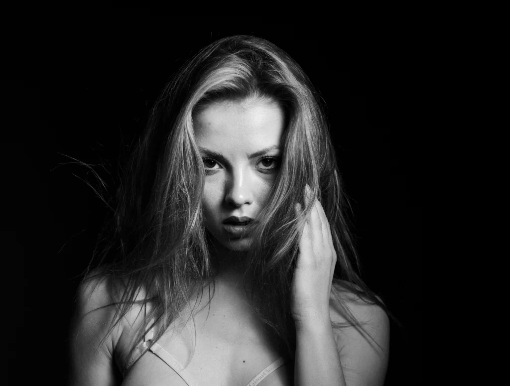 Beautiful blonde woman in black and white picture