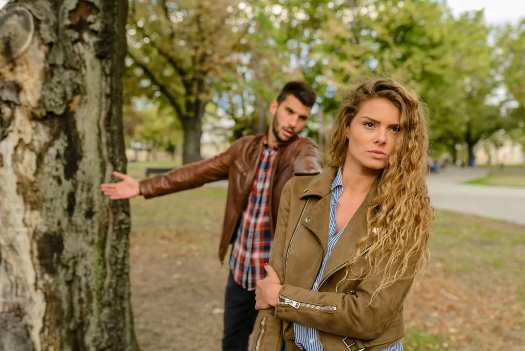 Woman turning away from husband angry