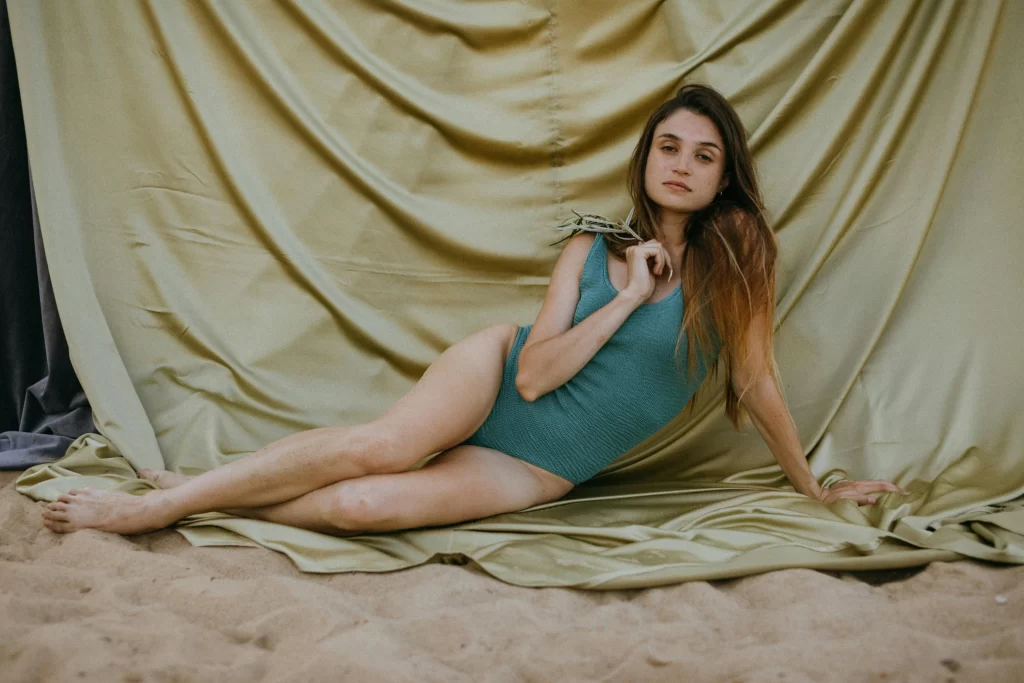 A beautiful woman in a bathing suit indoors 