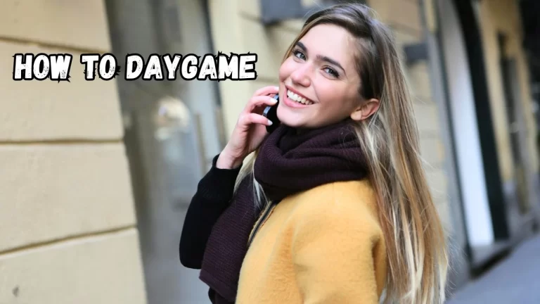 A pretty young woman on the phone and smiling at the camera