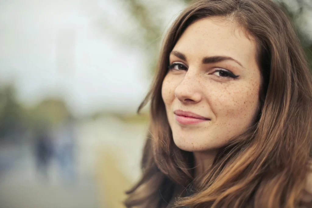 A beautiful brunette woman smiling at the camera