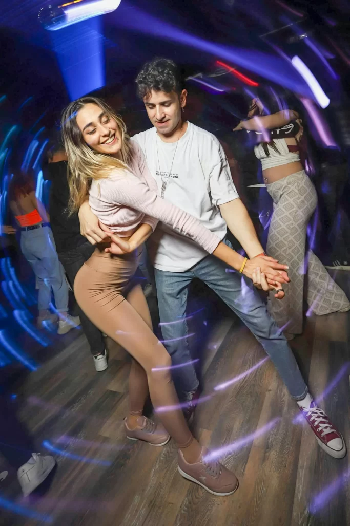 Man dancing with girl at a night club